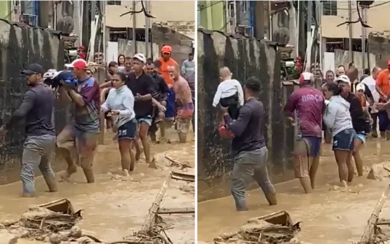 Moradores fazem corrente humana para resgatar bebê de colo